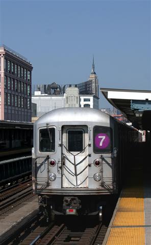 subway train going through cityscape