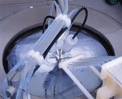 a wet sonic cleaning component spinning
